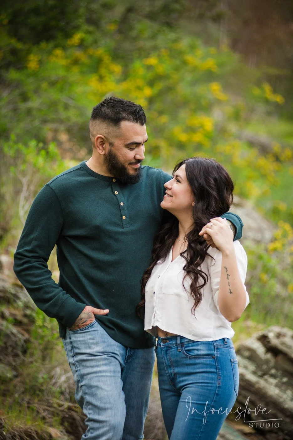 A couple laughing together outdoors